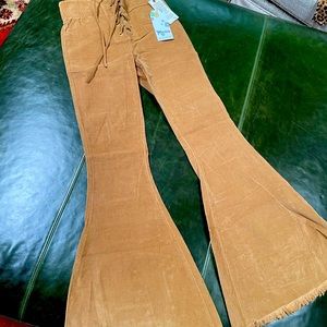 Show me your mumu 
Tan corduroy lace up flare pants
